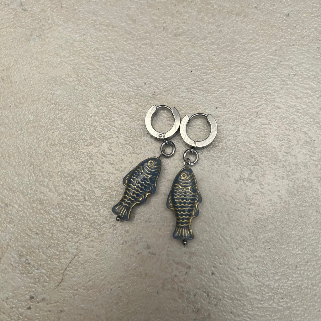 Gold on grey stainless fish