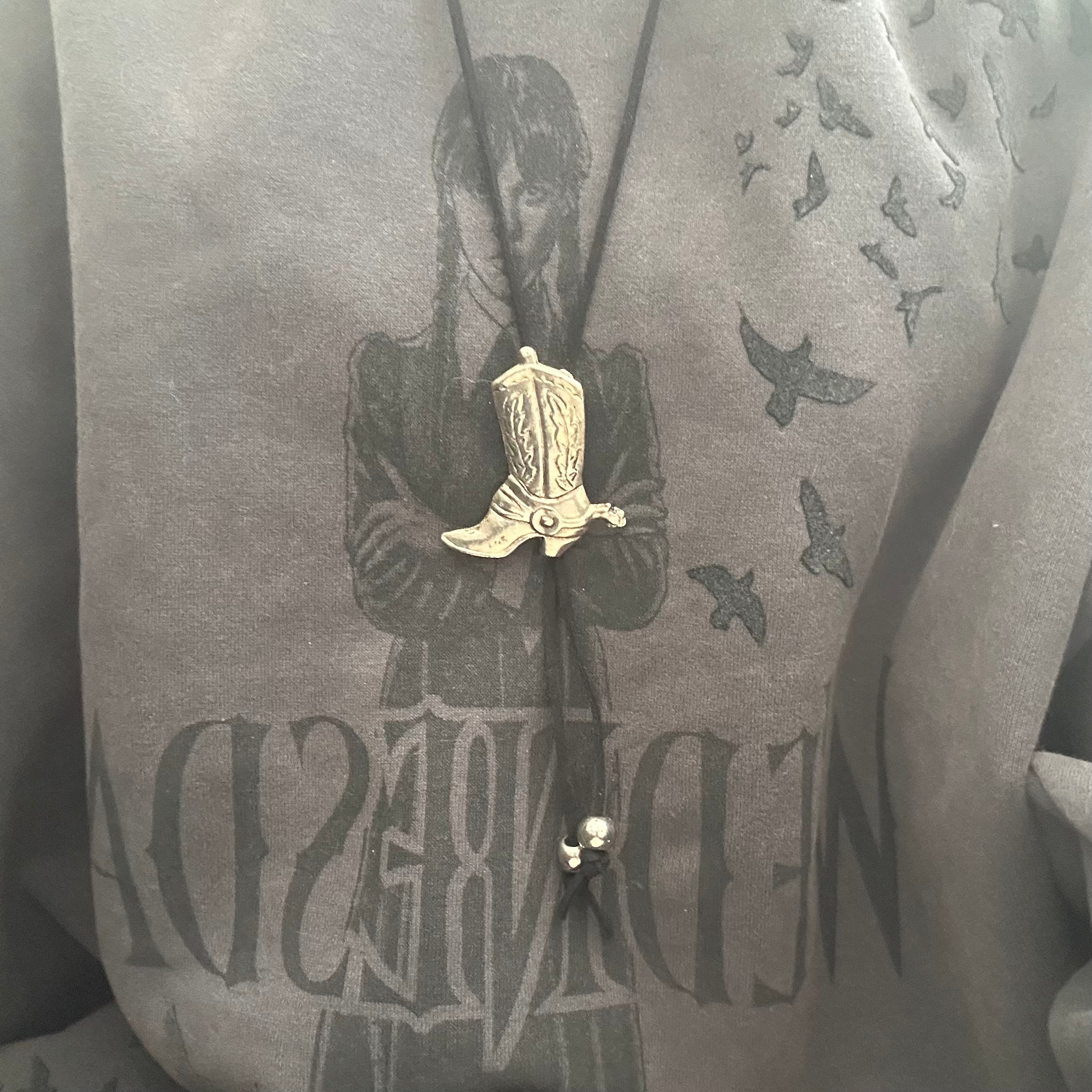 Handmade bolo tie with vintage cowboy boot pendant and upcycled beads