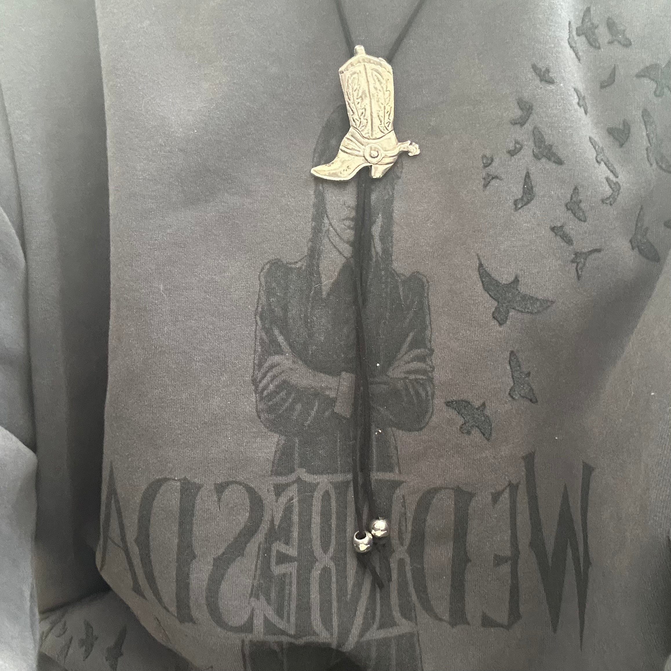 Handmade bolo tie with vintage cowboy boot pendant and upcycled beads