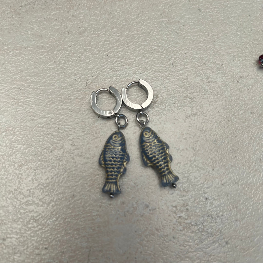 Gold on grey stainless fish