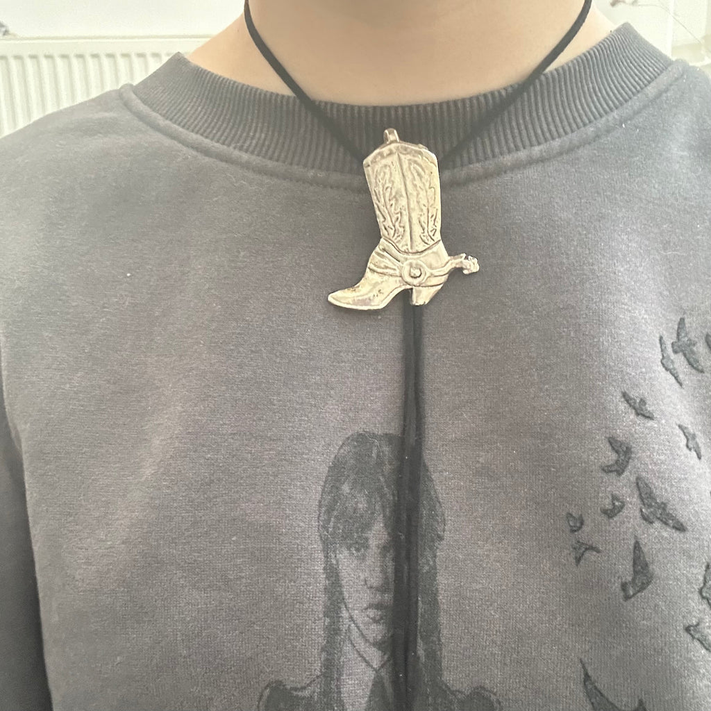 Handmade bolo tie with vintage cowboy boot pendant and upcycled beads