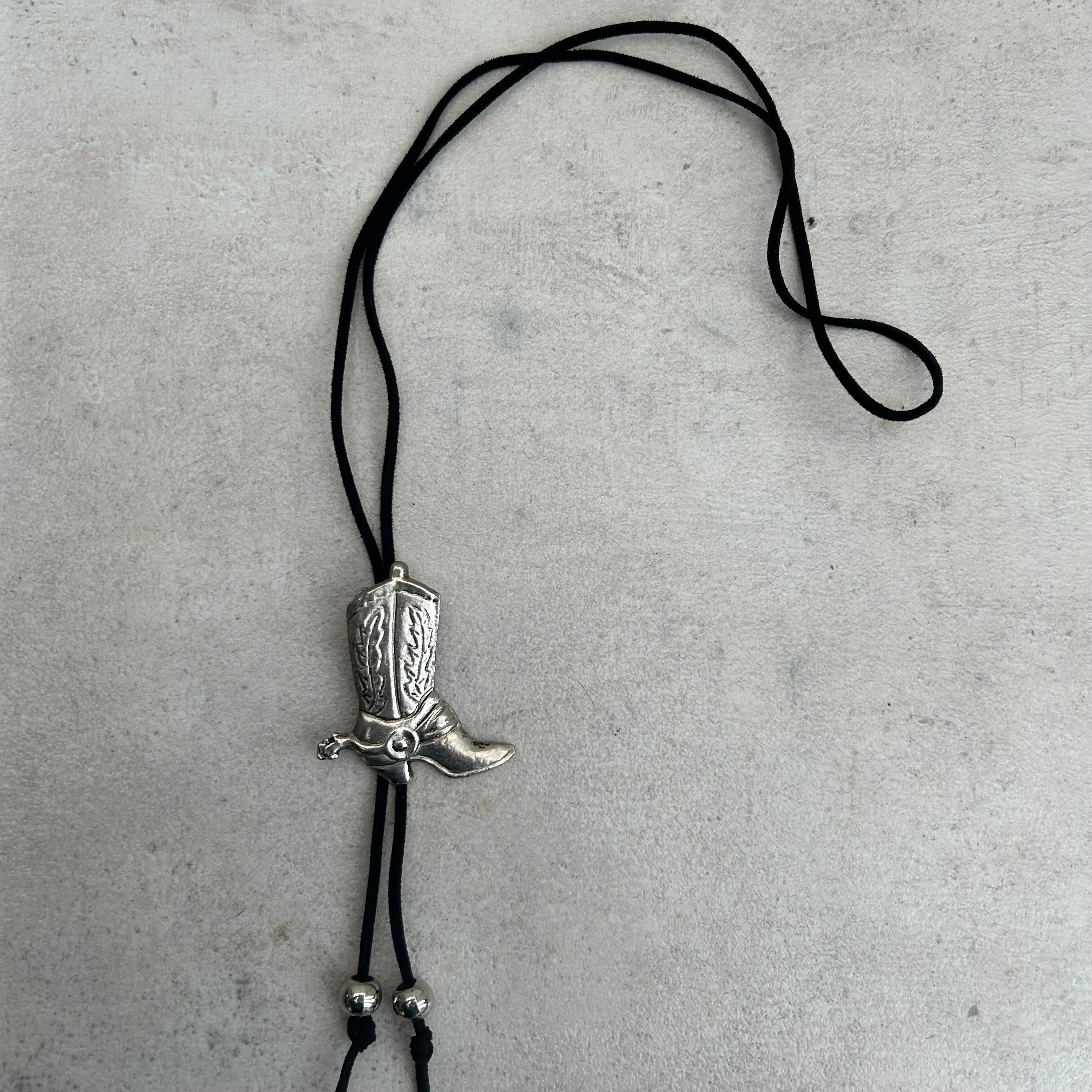 Handmade bolo tie with vintage cowboy boot pendant and upcycled beads