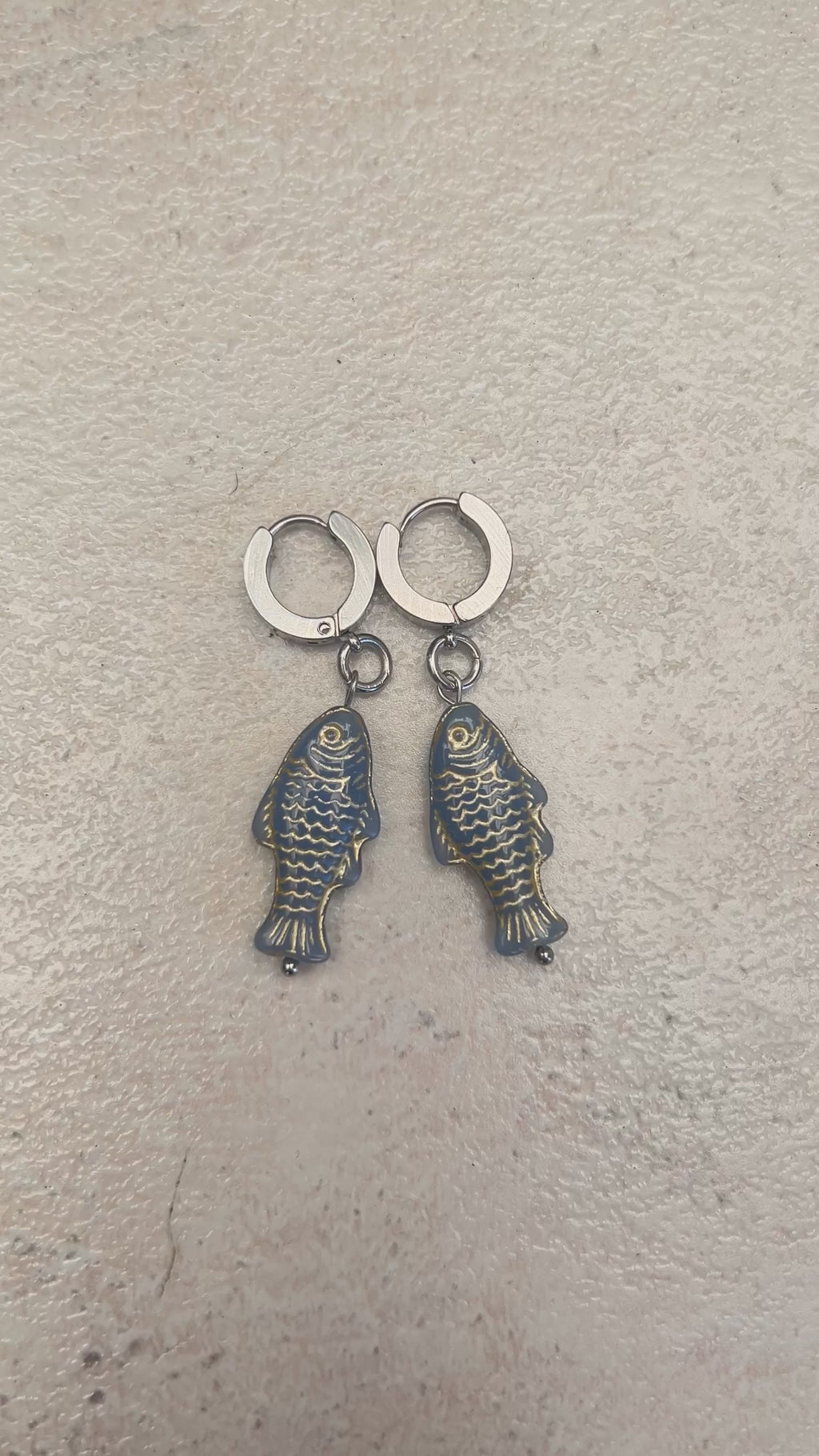 Gold on grey stainless fish